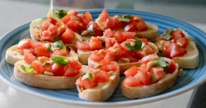 Bruschetta met tomaat basilicum en geroosterde pijnboompitten jun 2021 950x500